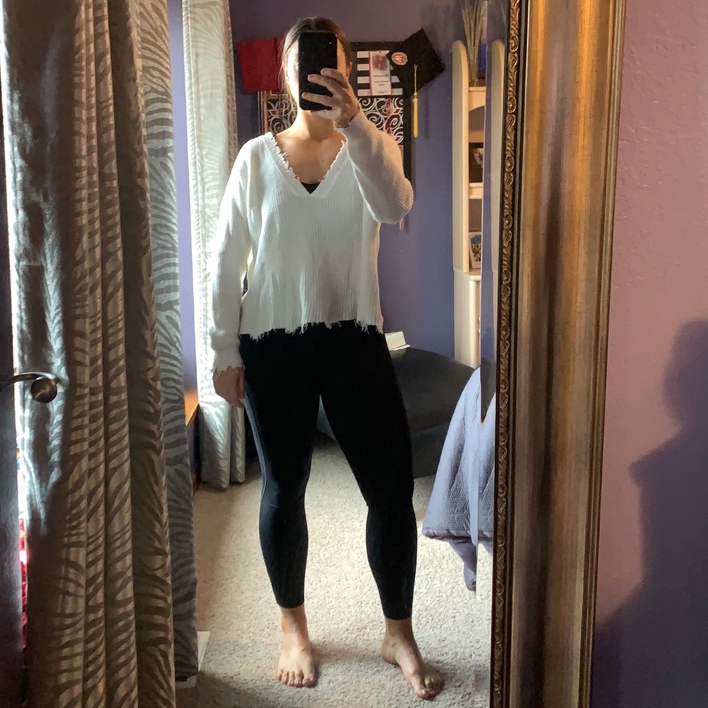 Distressed white sweater